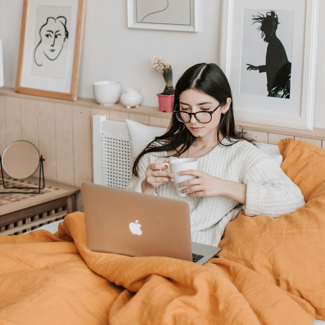 Person with coffee and a laptop